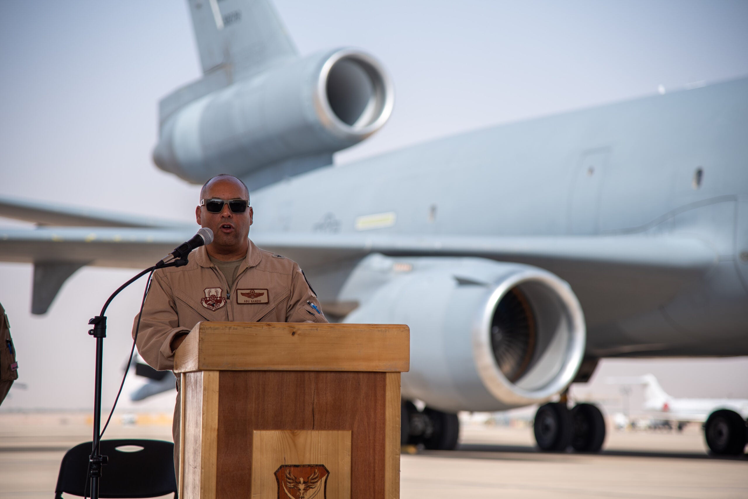 U.S. Air Force Brig. Gen. Akshai Gandhi, 378th Air Expeditionary Wing commander, delivers his remarks during the inactivation ceremony for the 908th Expeditionary Air Refueling Squadron at Prince Sultan Air Base, Kingdom of Saudi Arabia, Oct. 4, 2023. The ceremony highlighted the legacy of the KC-10 after over 30 years of service within the U.S. Air Forces Central (AFCENT) Area of Responsibility. By September 2024, the U.S. Air Force's fleet of KC-10s will be decommissioned and gradually replaced by the KC-46 aircraft. (U.S. Air Force photo by Tech. Sgt. Alexander Frank)