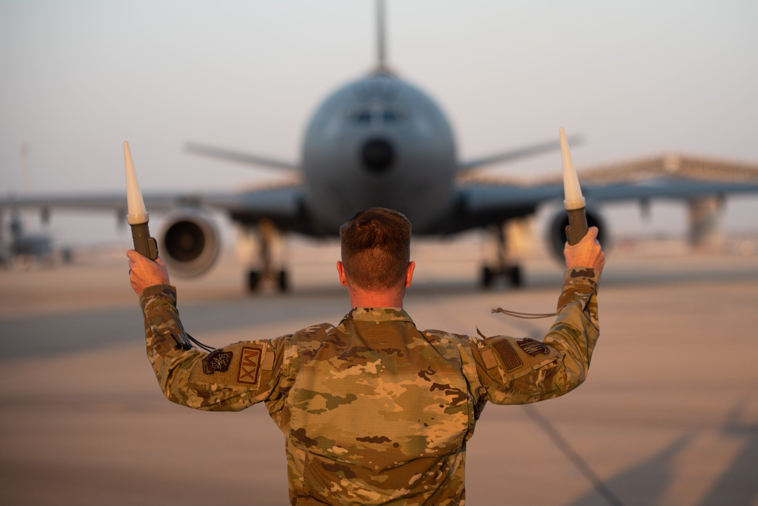 U.S. Air Force Col. Clinton Varty, 60th Maintenance Group commander, taxi's out the last KC-10 at Prince Sultan Air Base (PSAB), Kingdom of Saudi Arabia, Oct. 5, 2023. The departure of the KC-10 at PSAB marked the end of the airframe's over 30 years of service within the U.S. Air Forces Central (AFCENT) Area of Responsibility. By September 2024, the U.S. Air Force's fleet of KC-10s will be decommissioned and gradually replaced by the KC-46 aircraft. (U.S. Air Force photo by Tech. Sgt. Alexander Frank)