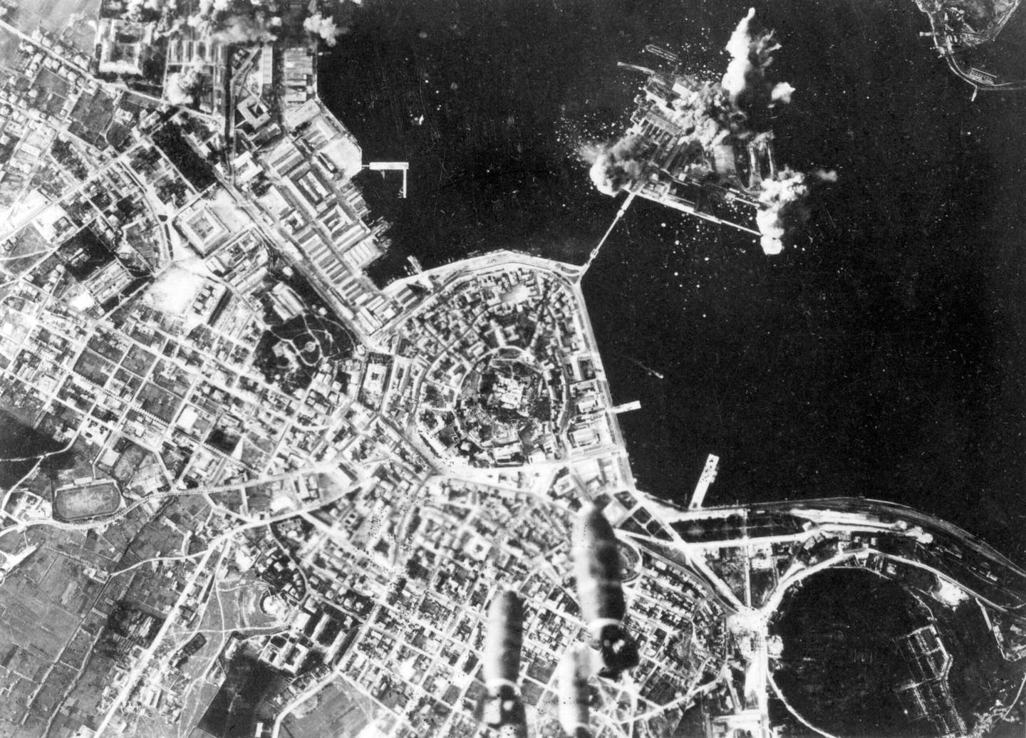 Aerial photo showing the bombing of the German-operated submarine base in Pola, Italy, on January 9, 1944. <em>Photo by USAAF/Interim Archive/Getty Images</em>