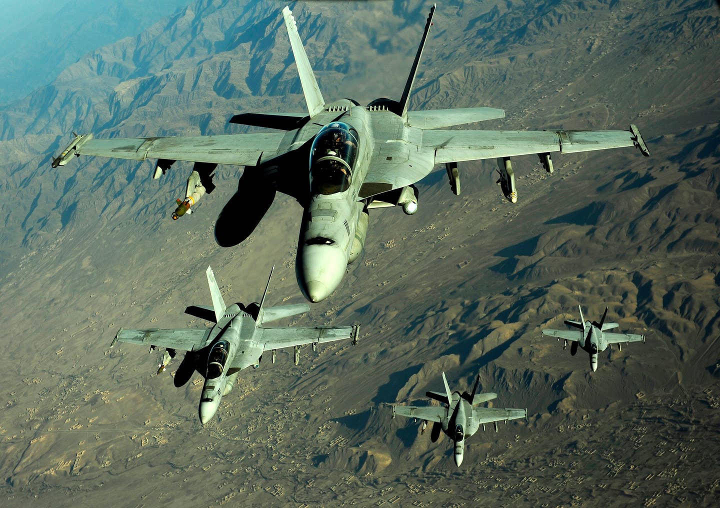 Four U.S. Navy F/A-18 Hornet aircraft fly over mountains in Afghanistan Nov. 25, 2010. (DoD photo by Staff Sgt. Andy M. Kin, U.S. Air Force/Released)