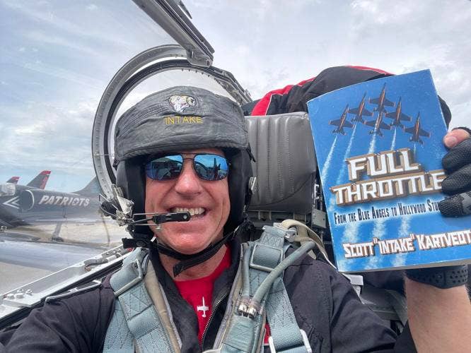 Scott celebrating being a newly minted published author in the cockpit of his L39 Albatross. (Scott Kartvedt)
