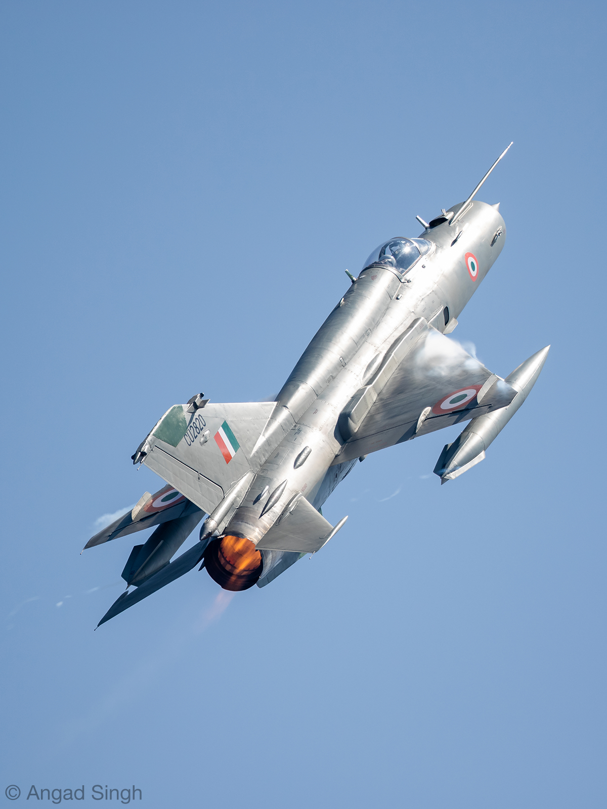 An Indian MiG-21 Bison climbs with afterburner engaged. <em>Angad Singh</em>