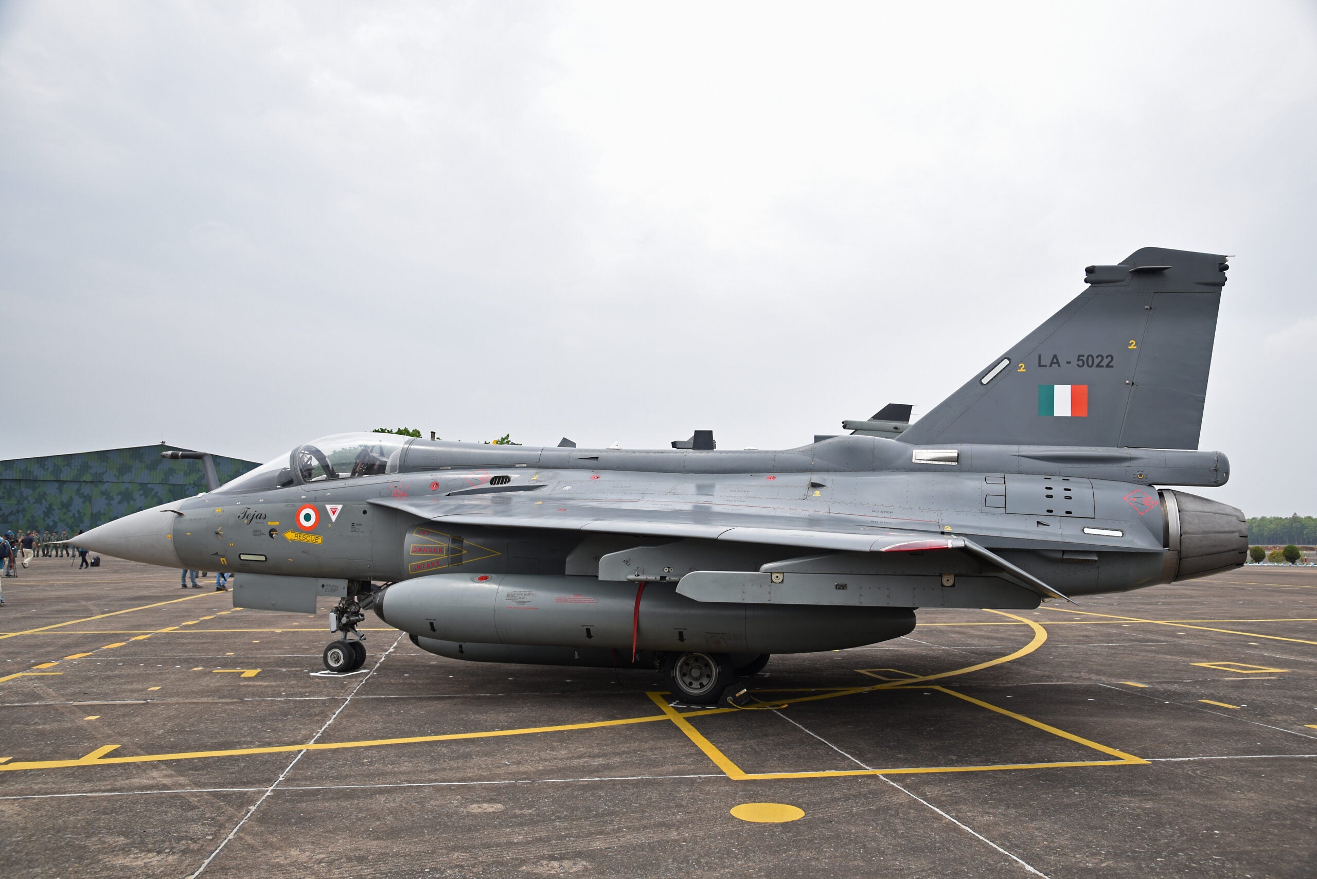 The Indian Air Force (IAF) is set to receive its first domestically-produced combat aircraft with beyond-visual range strike capabilities next February, the defence ministry said on Friday. The delivery of Tejas LCA-Mk-1A aircraft by Hindustan Aeronautics Limited (HAL) is expected to begin in February 2024, the ministry said in a statement, as it marked the seventh anniversary of the induction of the made-in-India fighter jet. The 83 LCA Mk-1A aircraft - contracted by the defence ministry in 2021 at a price of Rs 47,000 crore - will also feature active electronically steered radar, an updated electronic warfare suite and a beyond-visual range missile system. This picture was taken on April 24, 2023 at the air force station in Kalaikunda, around 170 km west of Kolkata, India. (Photo by Debajyoti Chakraborty/NurPhoto via Getty Images)
