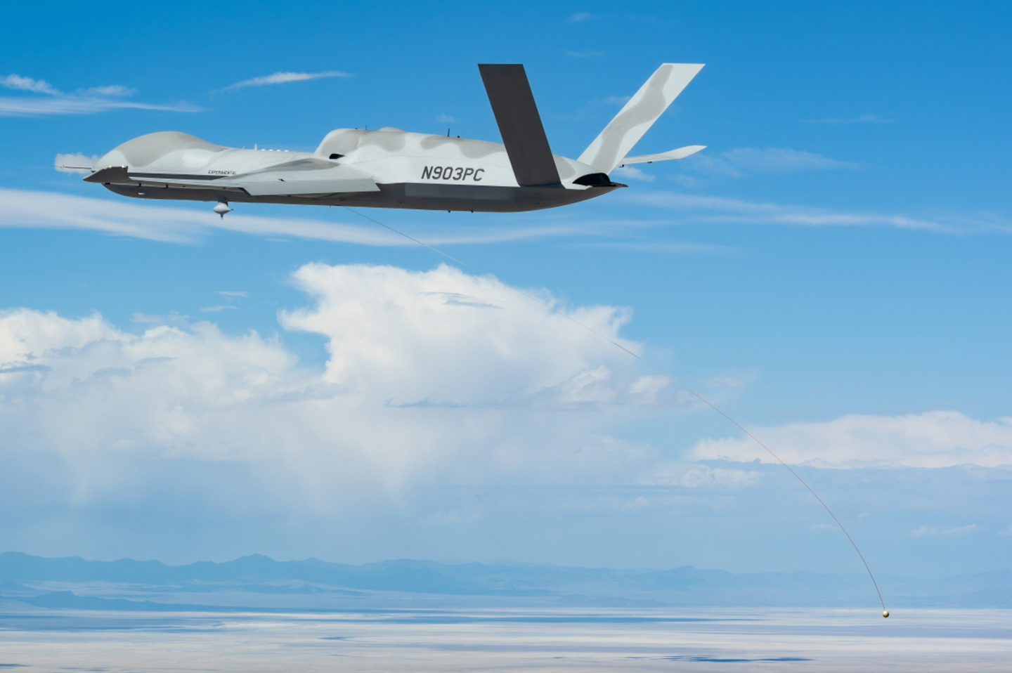 An MQ-20 Avenger trails the towline and smart end feature during the test last month. <em>GA-ASI </em>