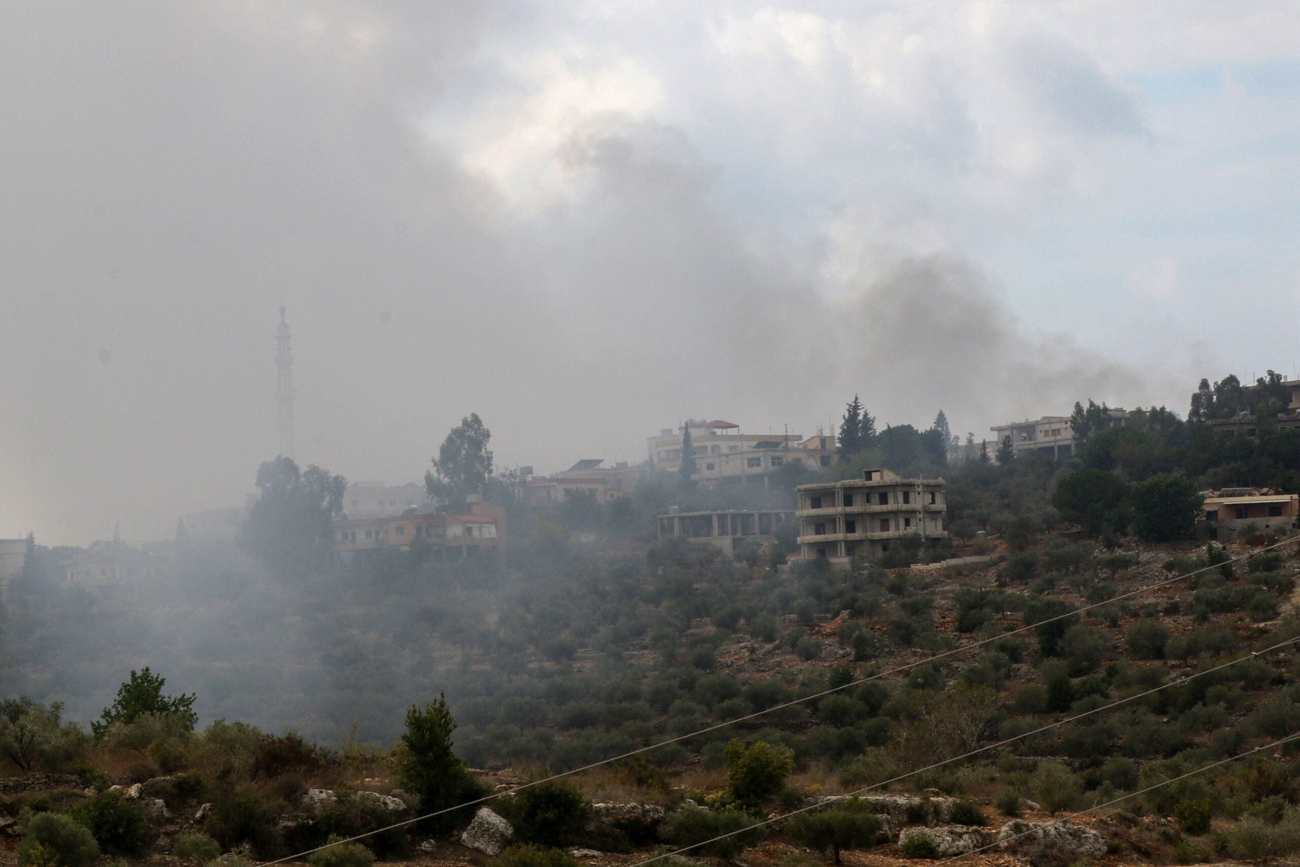 A general view shows smoke rising on a hill shelled by Israeli forces on the outskirts of the southern Lebanese border village of Dhaira on October 11, 2023. Lebanon's Iran-backed Hezbollah and Israel exchanged fire on October 11, in missile strikes the group said were retaliation for the killing of three members, on the fourth day of cross-border tensions. (Photo by Mahmoud ZAYYAT / AFP) (Photo by MAHMOUD ZAYYAT/AFP via Getty Images)