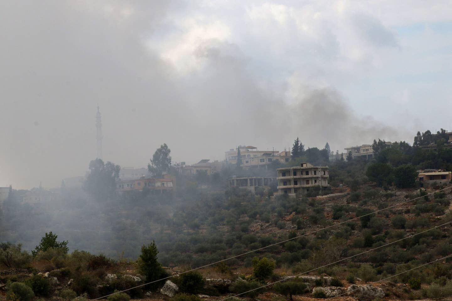 Smoke rising on a hill shelled by Israeli forces on the outskirts of the southern Lebanese border village of Dhaira on October 11, 2023. <em>Photo by MAHMOUD ZAYYAT/AFP via Getty Images</em>