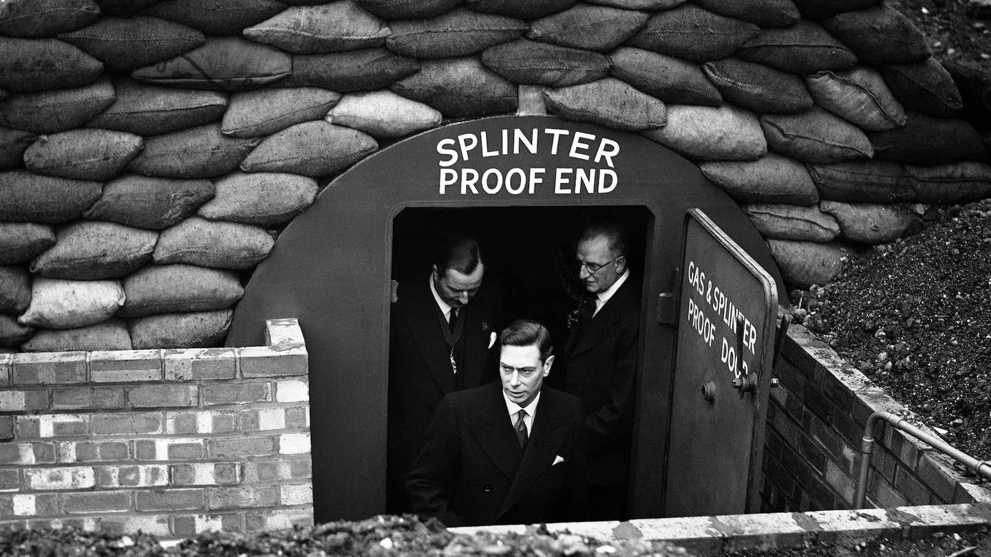 When the King visited the heavy industries section of the British industries fair at Birmingham on March 1, his Majesty inspected a steel and concrete air-raid shelter buried 20ft deep. The King showed a keen interest, asking what King of protection the shelter gave, and was told it would resist the effects of a direct hit. His majesty entered both chambers in the shelter, one of which was designed to be gas-proof. The King leaving the air-raid shelter in which he was much interested when he toured the heavy industries section of the British industries fair at Castle Bromwich, during his visit to Birmingham on March 1, 1939. (AP Photo)