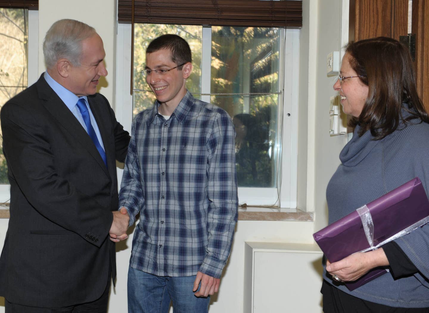 Israeli Prime Minister Benjamin Netanyahu meets with Gilad Shalit five months after his release on March 29, 2012, in Tel Aviv, Israel. Gilad Shalit was released on October 18, 2011, as part of a prisoner exchange, after being held captive by Hamas militants in the Gaza Strip for more than five years. (Photo by Moshe Milner/GPO via Getty Images)