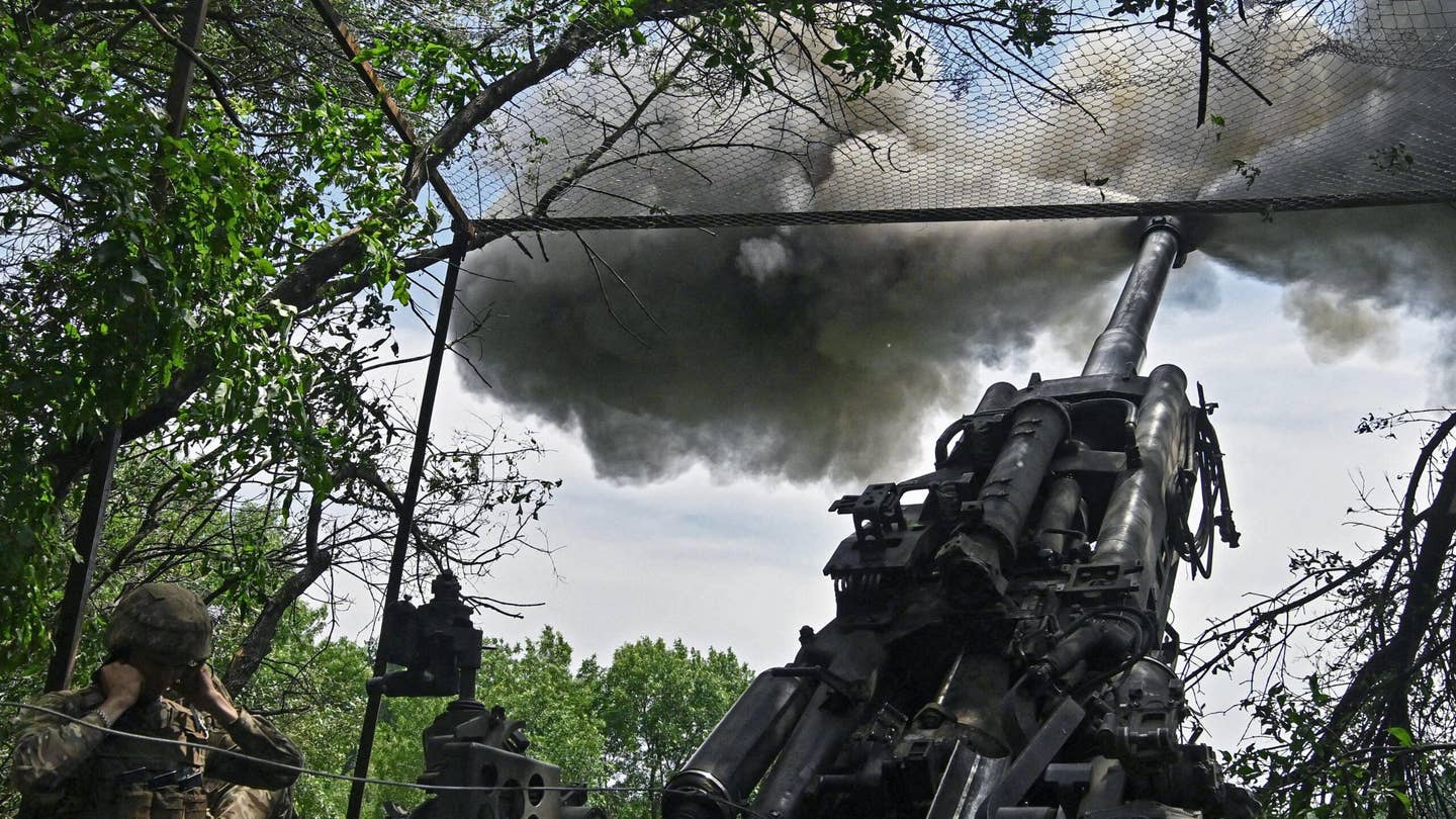 Ukrainian artillerymen fire a M777 howitzer