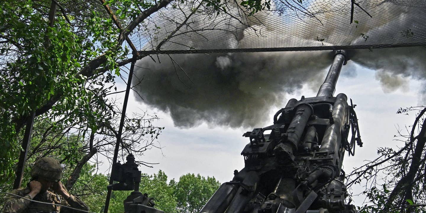 Ukrainian artillerymen fire a M777 howitzer