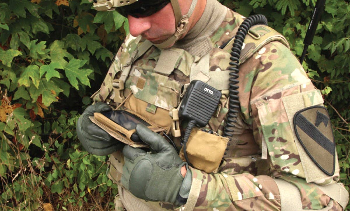 Tablet-like smartphone-sized devices like the one seen in use here are now commonplace in the US Army and elsewhere in the US military. <em>US Army</em>