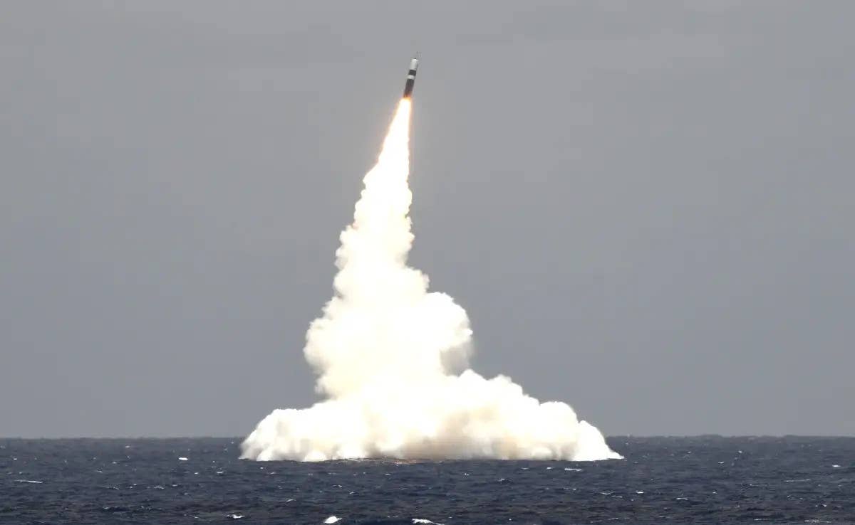 The US Navy's <em>Ohio</em> class nuclear ballistic missile submarine USS <em>Rhode Island</em> fires a Trident II missile during a test. <em>USN</em>