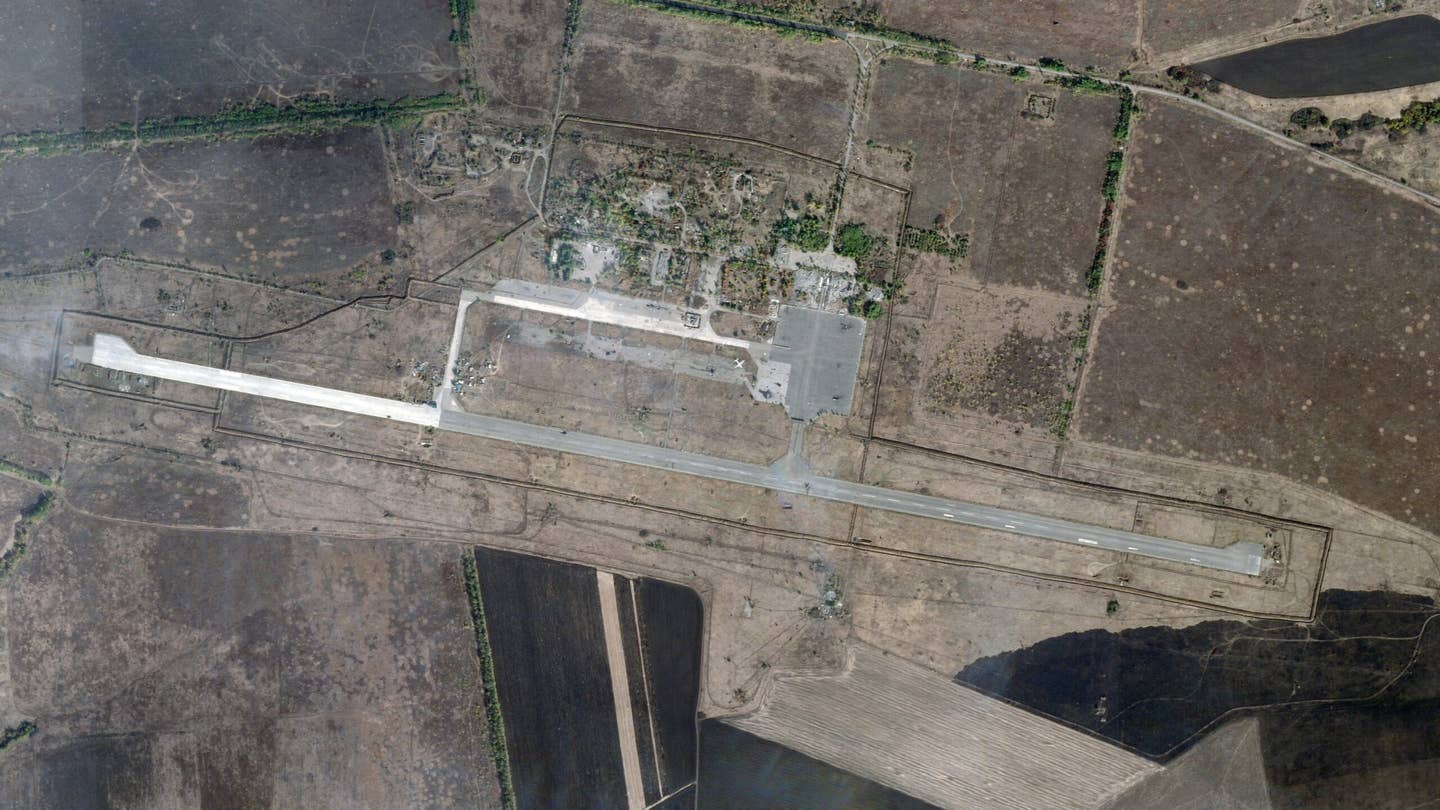 A satellite image of Luhansk airbase from October 20, 2023, shows scorch marks on the parking area consistent with the destruction of several helicopters. A closer view of the damage is provided at the top of this story. <em>PHOTO © 2023 PLANET LABS INC. ALL RIGHTS RESERVED. REPRINTED BY PERMISSION</em>