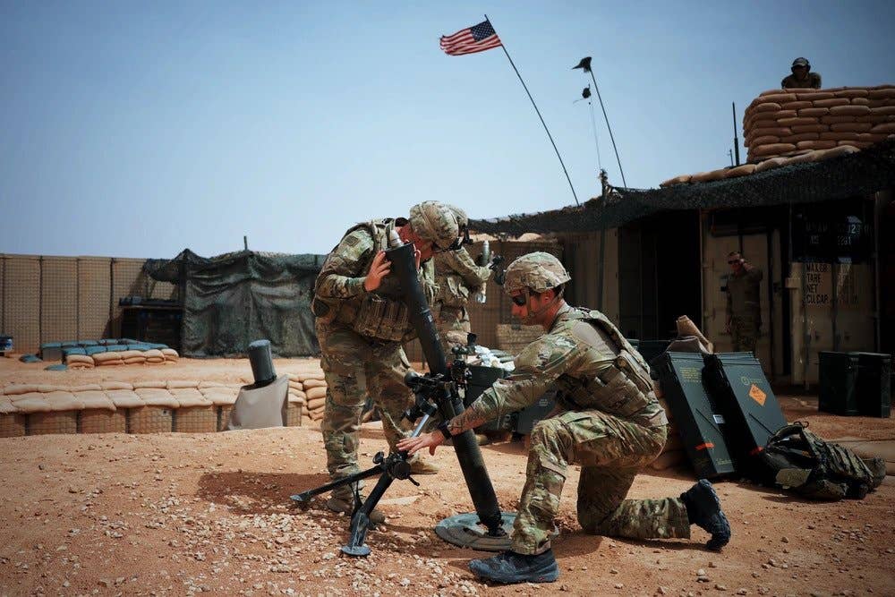 Soldiers deployed to At-Tanf Garrison, Syria, fire an 81 mm mortar weapon system during a readiness exercise on April 22, 2020. (U.S. Army photo by Staff Sgt. William Howard)
