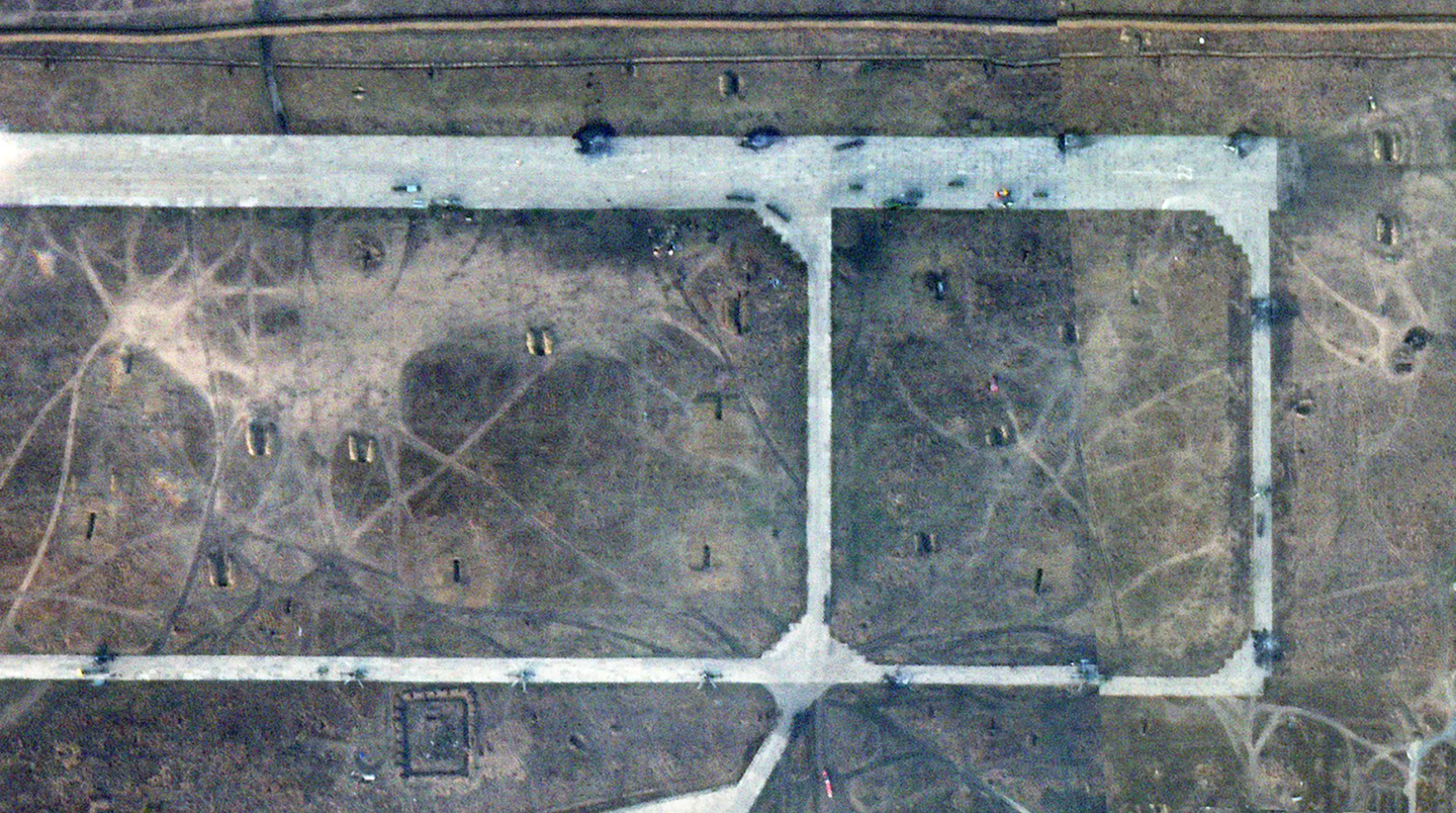 Satellite imagery taken on October 18 shows at least nine distinct scorch marks, most with wreckage also visible, along the main runway and adjacent taxiways at the eastern end of Berdyansk airport. <em>PHOTO © 2023 PLANET LABS INC. ALL RIGHTS RESERVED. REPRINTED BY PERMISSION</em><br>