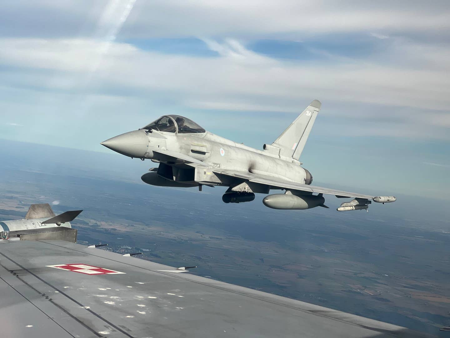 Operation Carson: A U.K. Royal  Air Force Typhoon fighter trails a Polish F-16 during air combat training in the Baltic region. Based in Poznan, Poland, the two-week detachment involved joint training with Polish, U.S., Spanish, and Italian Air Forces undertaking various air combat exercises across Poland and Lithuania. <em>Crown Copyright</em>