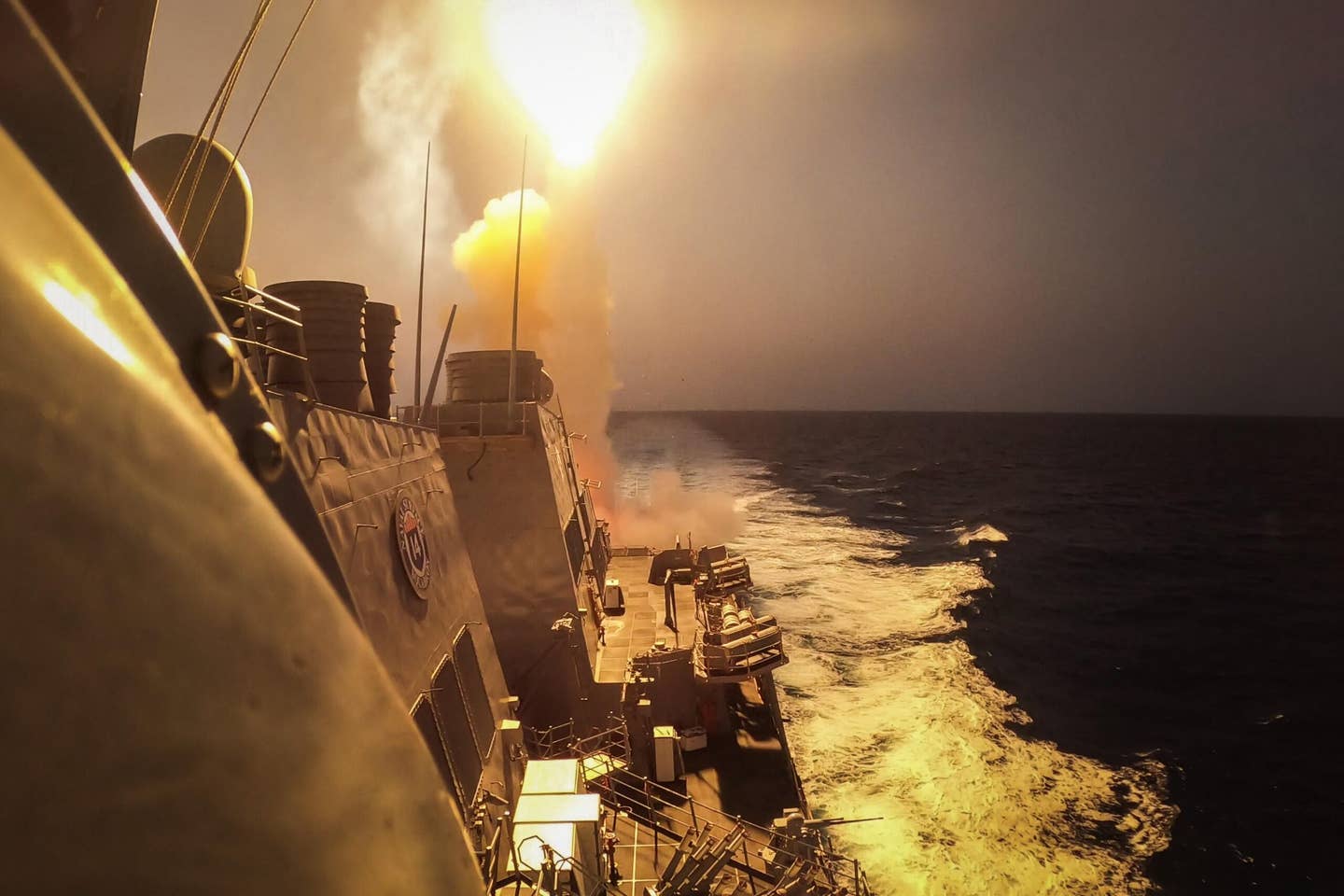 The <em>Arleigh Burke</em>-class guided-missile destroyer <em>USS Carney</em> (DDG 64) defeats a combination of Houthi missiles and unmanned aerial vehicles in the Red Sea, Oct. 19. (U.S. Navy photo by Mass Communication Specialist 2nd Class Aaron Lau)
