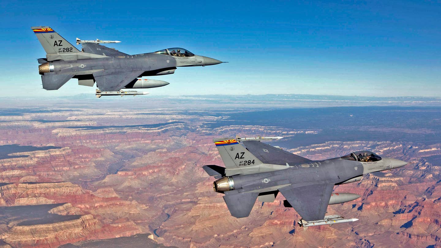 Capt. Bob Peel, left, and Lt. Col. Tony Adamo, right, F-16 instructor pilots from the 162nd Fighter Wing, fly over the Grand Canyon while supporting Operation Noble Eagle’s air sovereignty alert mission.