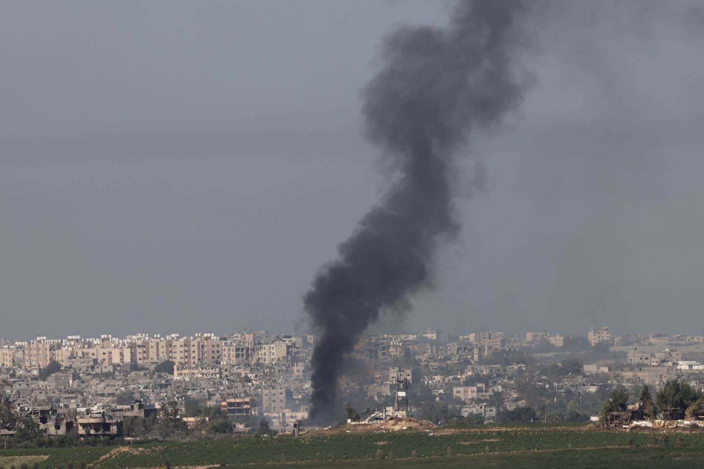 A photo taken from the southern Israeli city of Sderot on October 26, 2023, shows black smoke billowing over the northern Gaza Strip, amid the ongoing war between Israel and the Palestinian group Hamas. <em>Photo by JACK GUEZ/AFP via Getty Images</em>