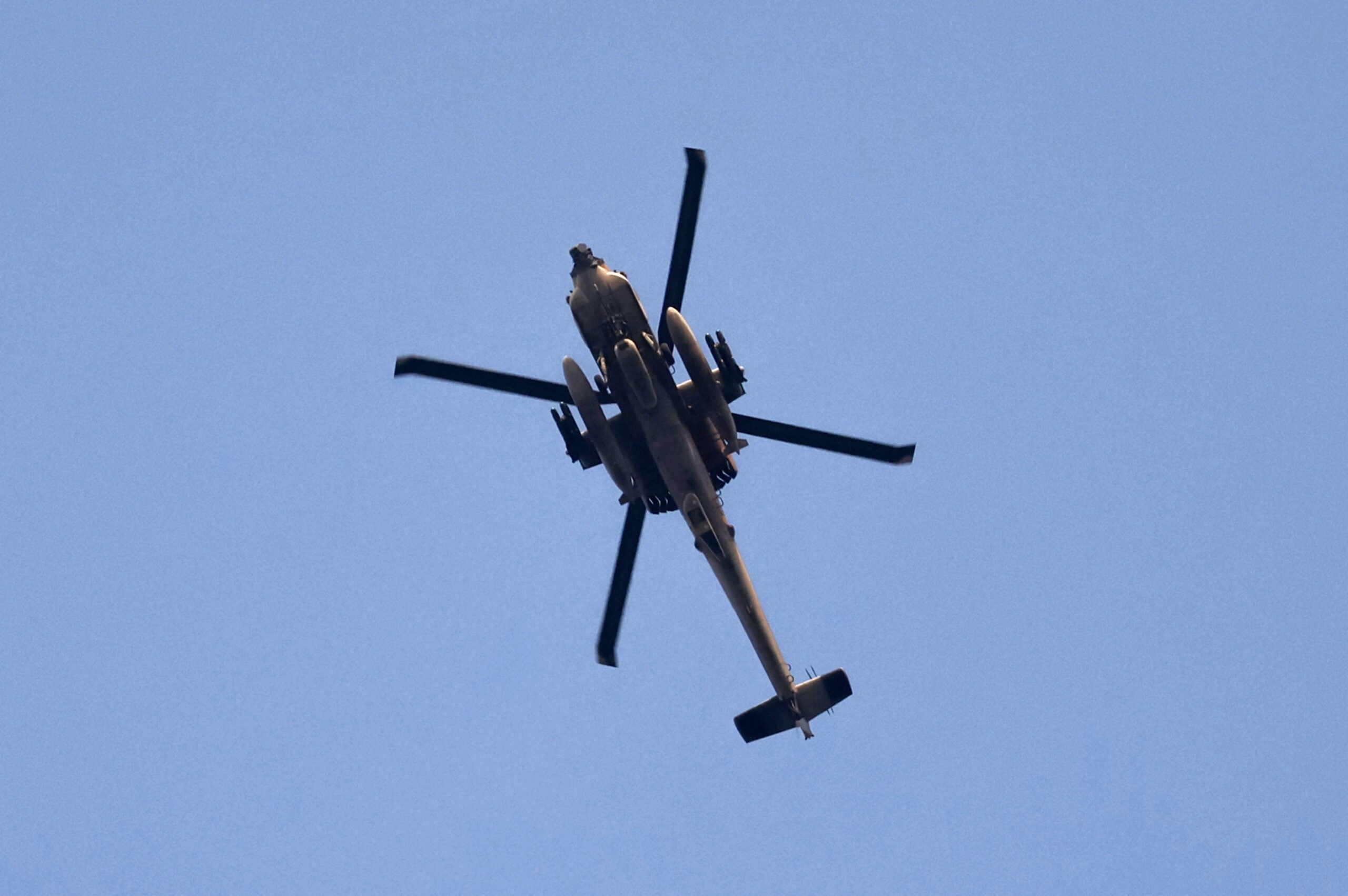 An Israeli Apache helicopter is pictured over the Israel's southern city of Ashkelon during an Israeli air strike on Gaza City, on August 5, 2022. - A senior militant from Islamic Jihad was killed in an Israeli air strike on the Gaza Strip today, prompting the militant group to warn Israel has "started a war".
A child was among those killed in the strikes, the enclave's health ministry said, while Israel's military estimated 15 were dead. (Photo by JACK GUEZ / AFP) (Photo by JACK GUEZ/AFP via Getty Images)