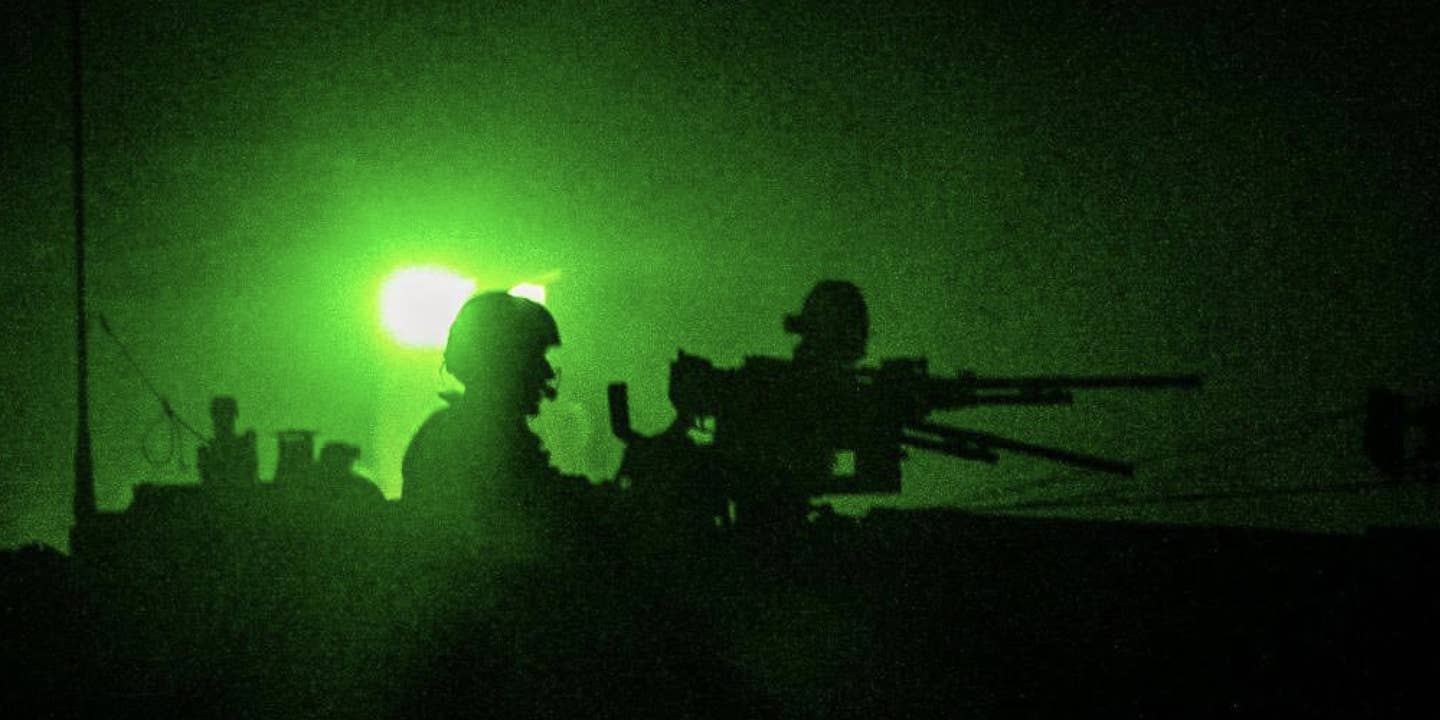 Israeli tank moves into Gaza at night.