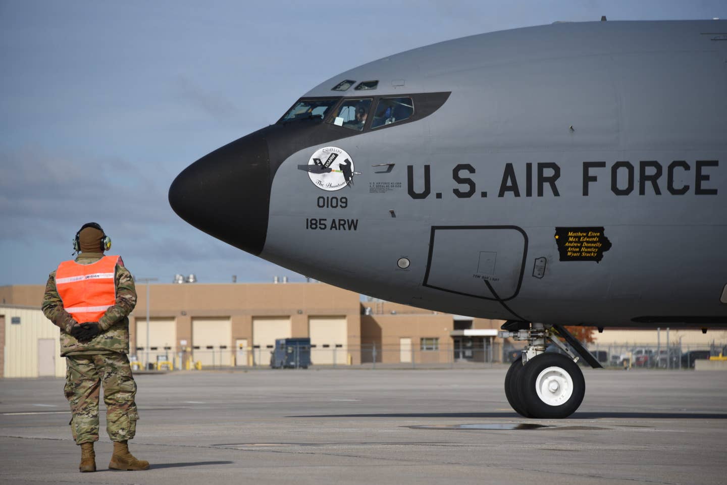 185th Air Refueling Wing Crew Chief Matthew Eiten marshaling 109 in Sioux City, Iowa, on October 28, 2021. Eiten was the lead crew chief of the Iowa Air National Guard KC-135 at this time. <em>U.S. Air National Guard photo Senior Master Sgt. Vincent De Groot</em>
