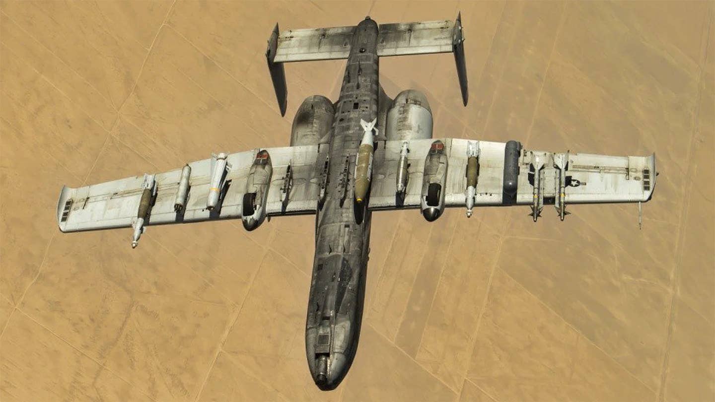 This picture of an inverted A-10 highlights its ability to carry a wide array of different stores on a single mission. <em>USAF</em>