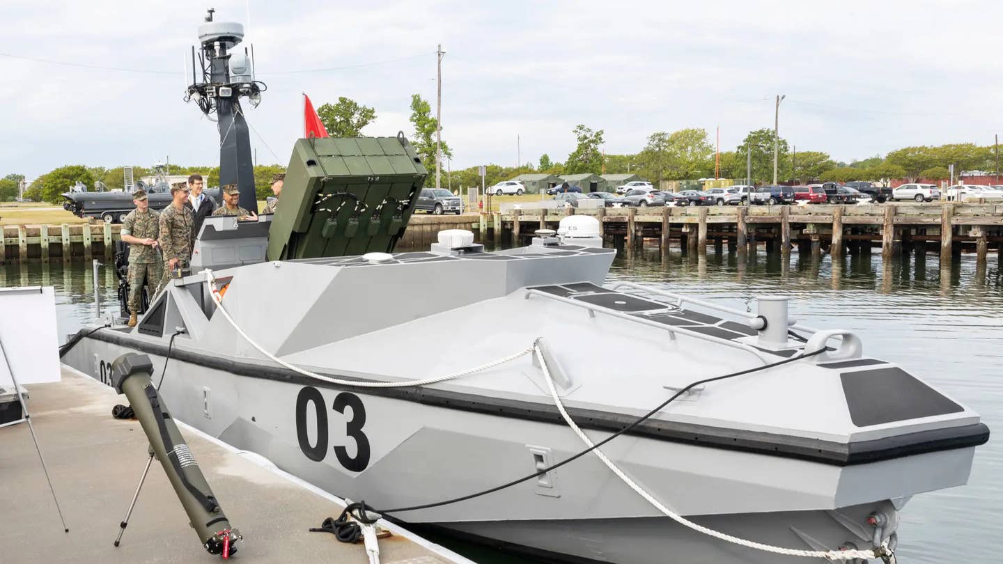 A Marine Long Range Unmanned Surface Vessel (LRUSV) drone boat with a six-round launcher for Hero-120 loitering munitions. <em>USMC</em>