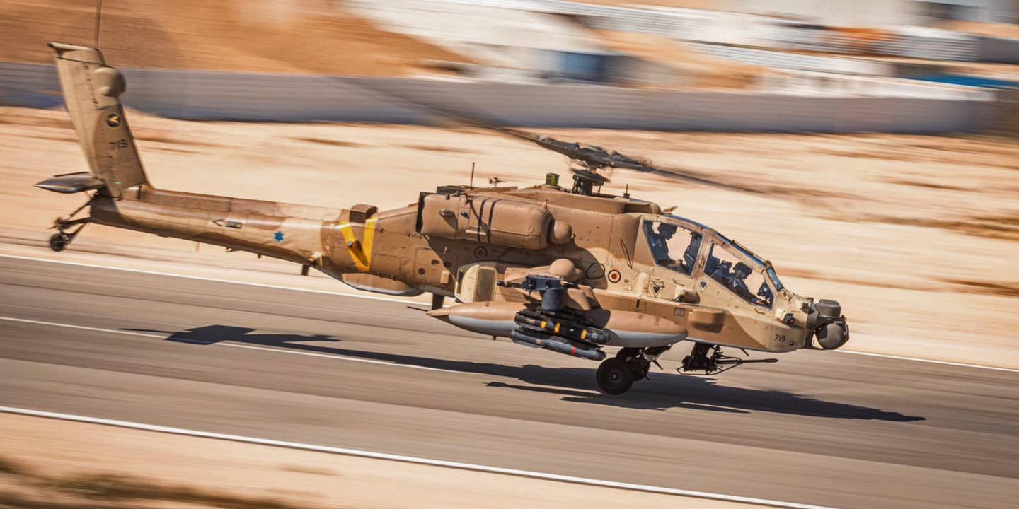 An Israeli Air Force AH-64 Apache with unusual Hellfire missile marking attached.