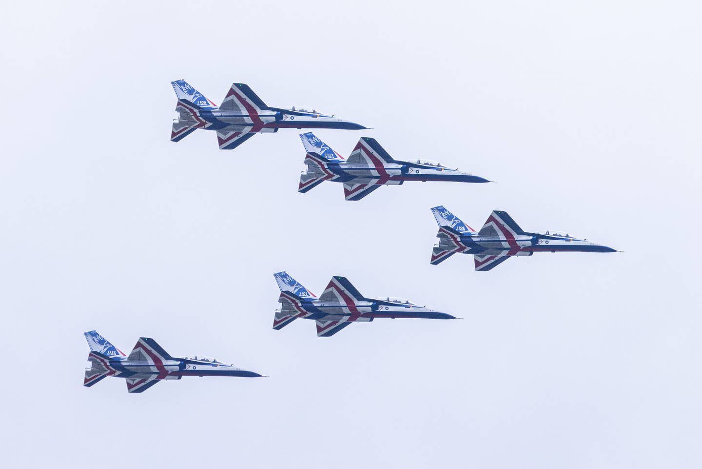 Five T-5 advanced jet trainers perform a flypast over Taipei on October 10, 2023, to mark Taiwan National Day. <em>Photo by Annabelle Chih/Getty Images</em>