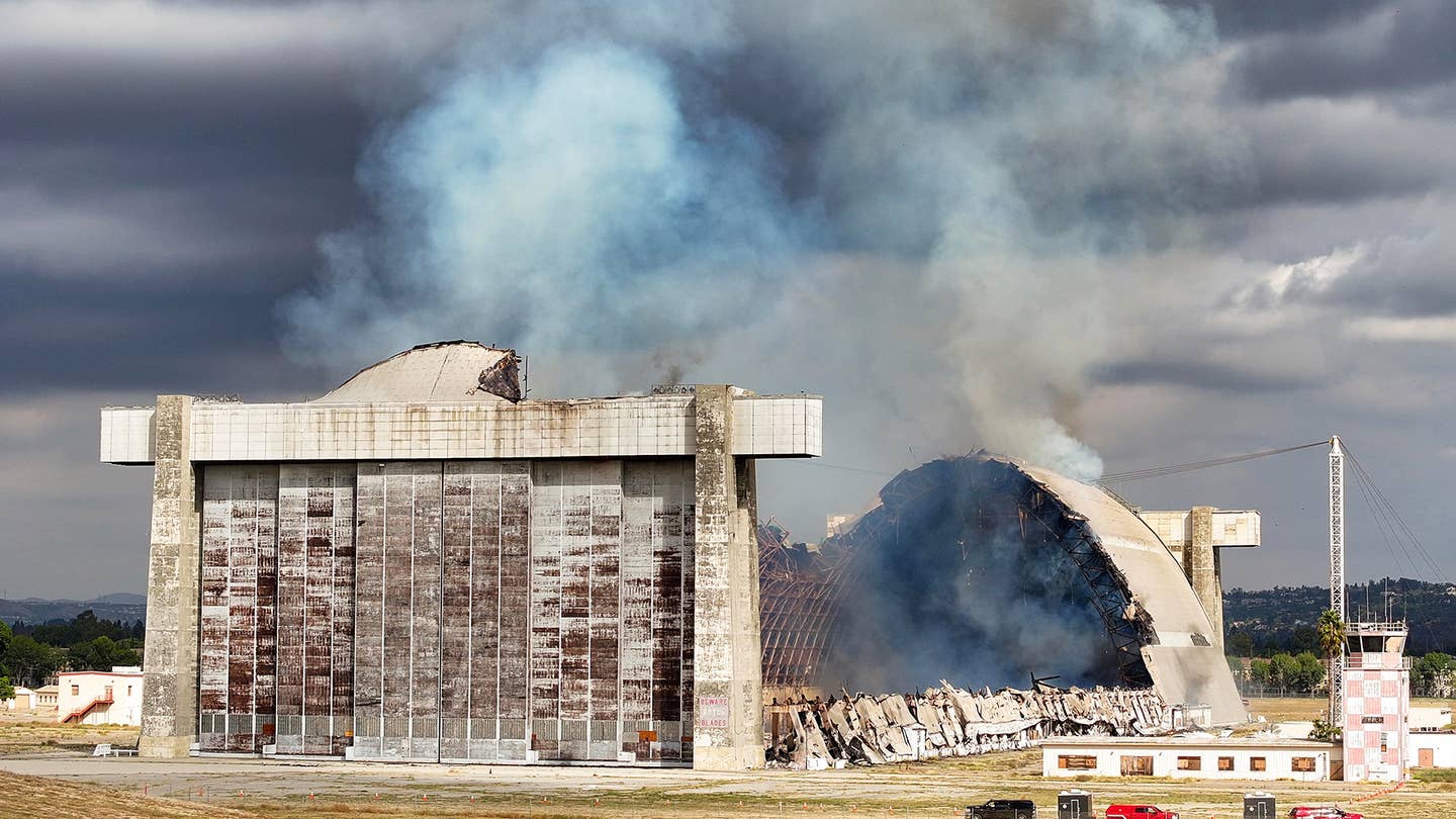 Tustin, CA - November 07: Firefighters work to control a blaze at the north blimp hangar at the former Marine Corps Air Station Tustin in Tustin, CA, on Tuesday, November 7, 2023.