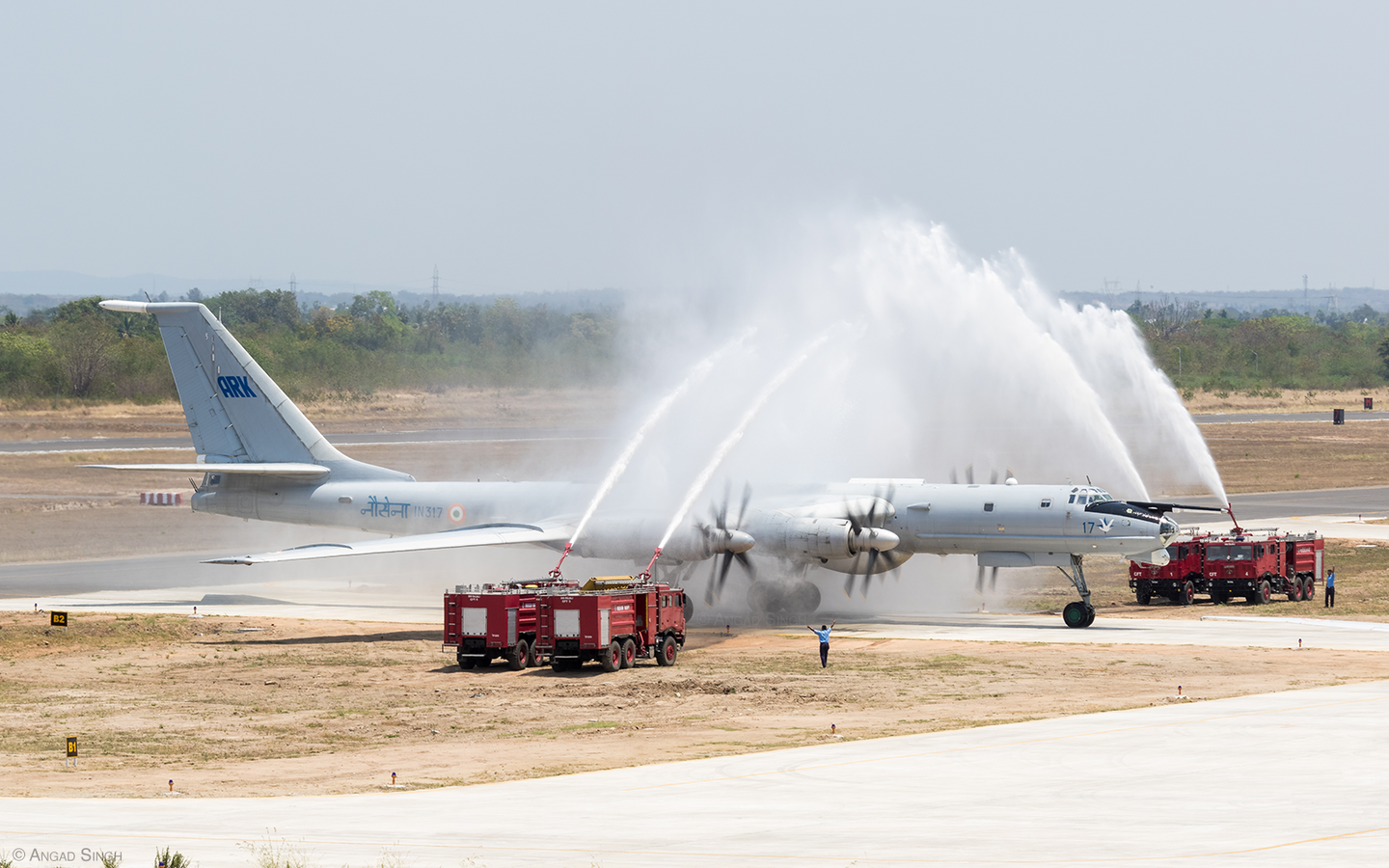 Tu-142 serial IN317 was welcomed by no less than four firefighting trucks after its final flight. <em>Angad Singh</em>