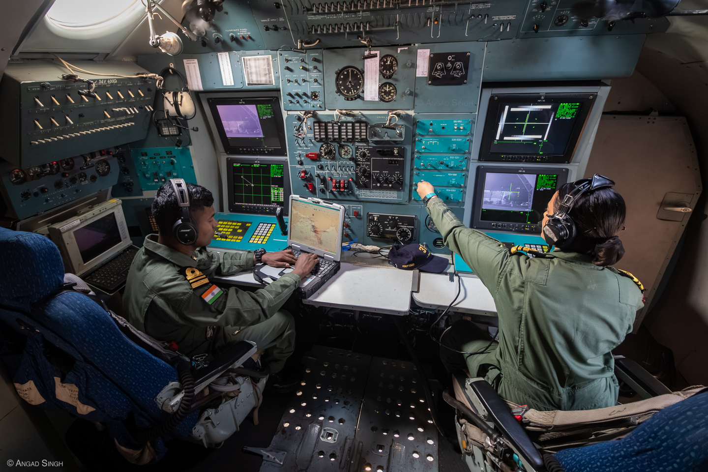 Two sensor operators at work in an Il-38. INAS 315 welcomed its first female aircrew in 2012. Over a decade later, they are a common sight, with three on strength as of October 2023. <em>Angad Singh</em>