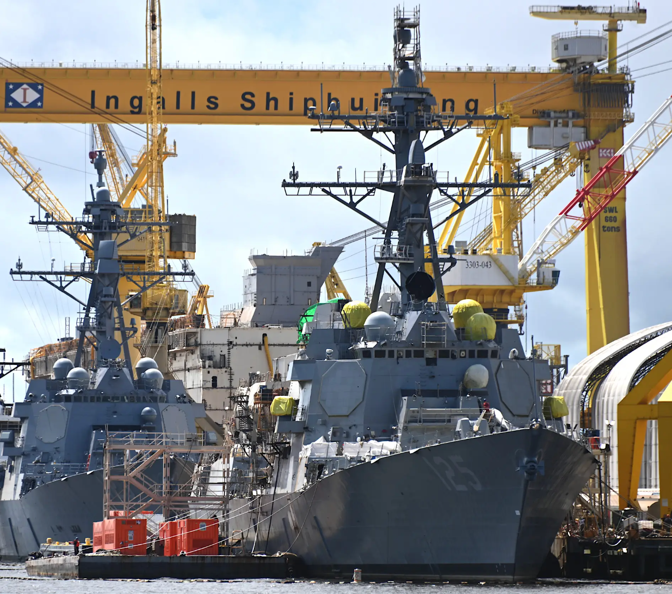 The future USS&nbsp;<em>Jack H. Lucas</em>&nbsp;being fitted out in Pascagoula, Mississippi in August 2022. The future USS&nbsp;<em>Lenah H. Sutcliffe Higbee</em>, a Flight IIA&nbsp;<em>Arleigh Burke</em>&nbsp;class destroyer, is directly behind, offering a good comparison between the fixed-face antennas for the new AN/SPY-6(V)1 radar and those for the older AN/SPY-1D fitted to earlier ships of this class. Neither vessel has SEWIP Block III installed.&nbsp;<em>Chris Cavas photo</em>&nbsp;<br>