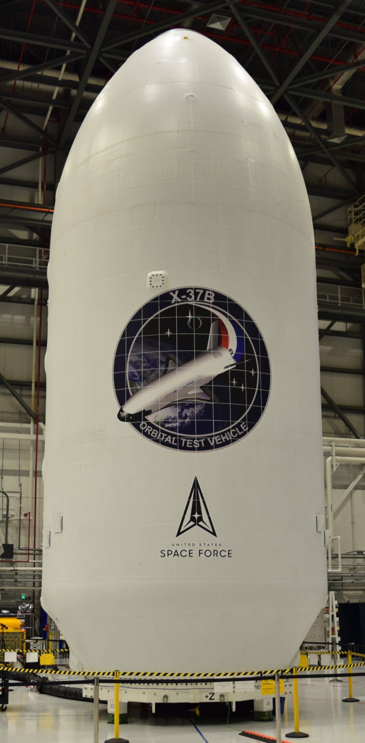 Featuring the U.S. Space Force (USSF) logo for the first time, the encapsulated X-37B Orbital Test Vehicle for the USSF-52 Mission. <em>Boeing via USSF</em>