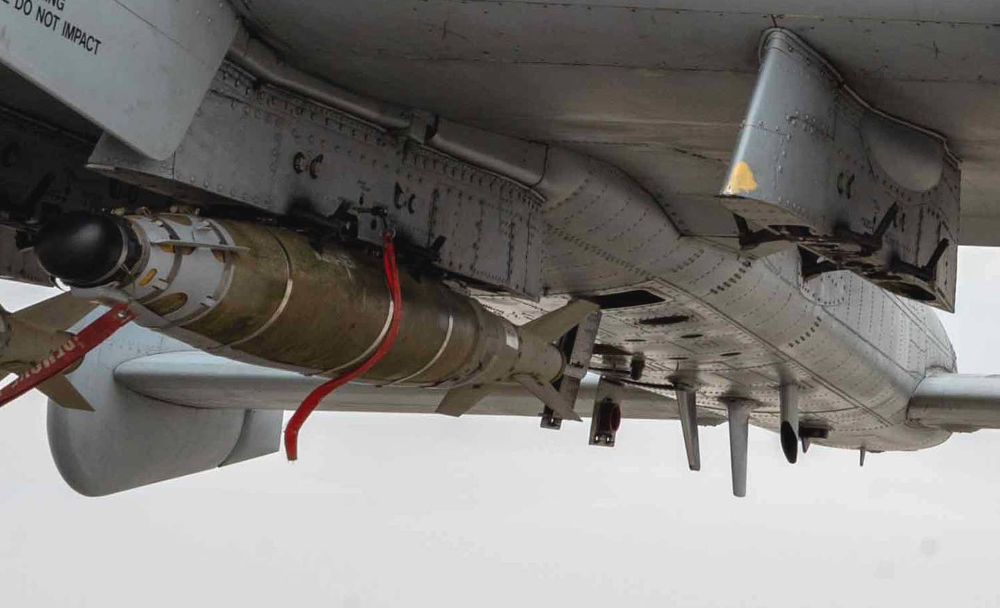 A full look at the LJDAM on one of the A-10s. The tail of the other JDAM loaded on this aircraft is just visible to the right. <em>USAF</em>