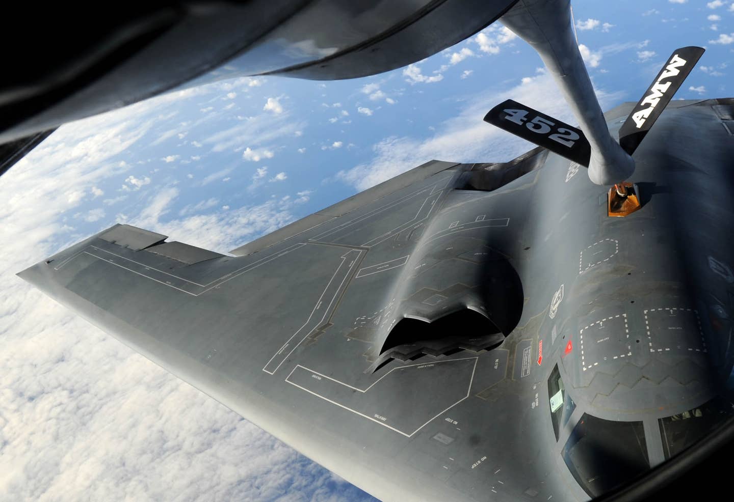 The B-2's far more prominent serrated intakes can be seen here, including the splitter plate between the fuselage and the intake opening that separates turbulent boundary layer air from the stable air entering the intake. (U.S. Air Force photo by Senior Airman Christopher Bush/Released)