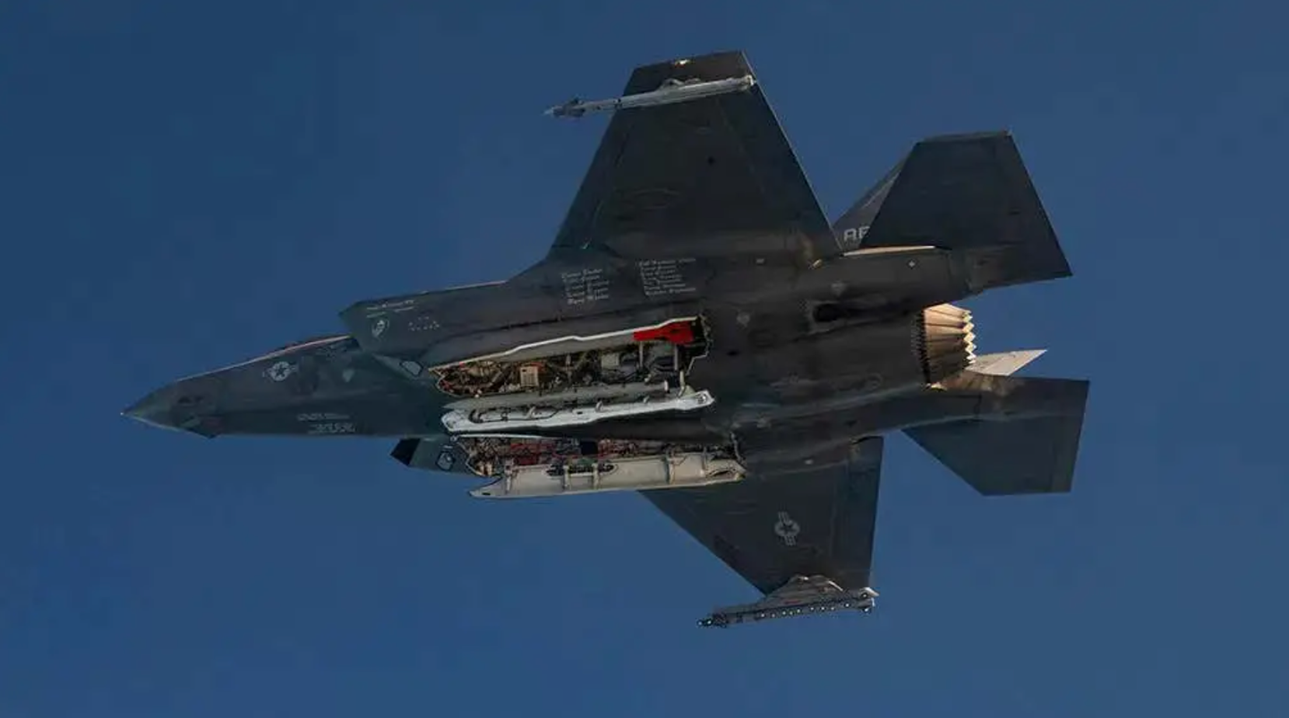The red tail of an inert B61-12 is visible inside the bomb bay of this F-35A during a test flight. The jet also carries at least one AIM-120 AMRAAM air-to-air missile in its weapons bays.&nbsp;<em>U.S. Department of Defense</em>