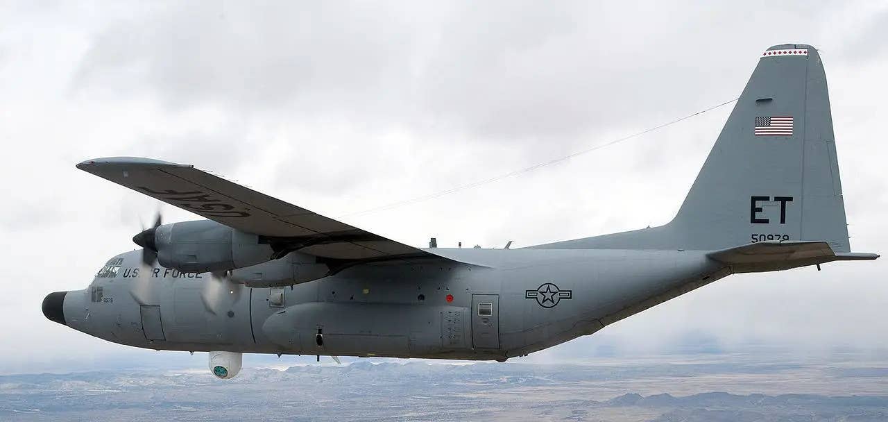 The C-130 testbed aircraft used during the ATL tests. Note the large beam projector turret under the forward fuselage. <em>USAF</em>