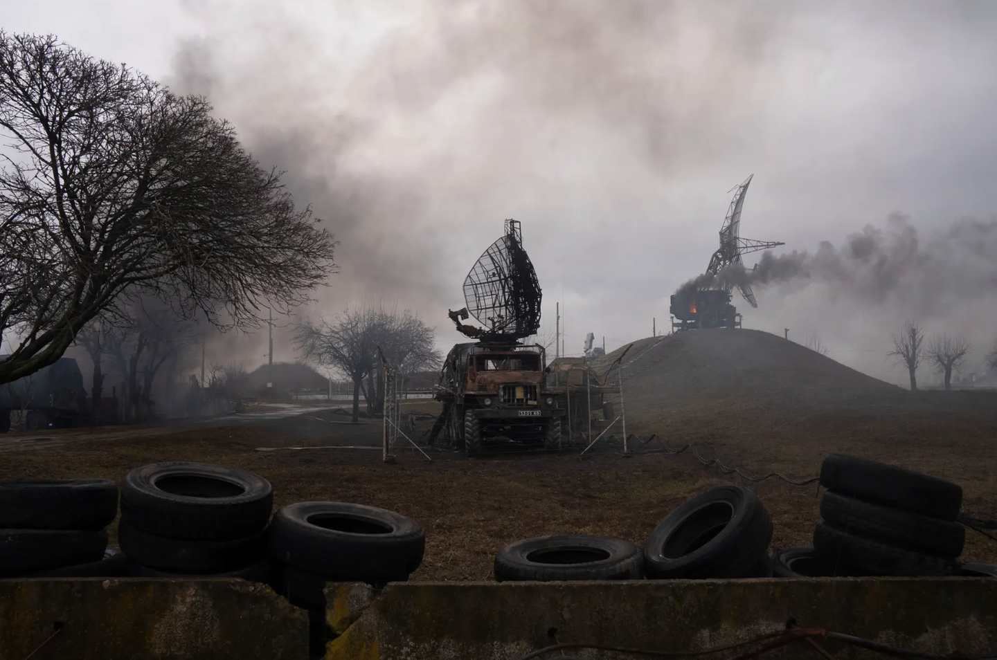Smoke rises from an air defense site in the aftermath of an apparent Russian strike in Mariupol, Ukraine, on the first day of the conflict.&nbsp;<em>AP Photo/Evgeniy Maloletka</em>