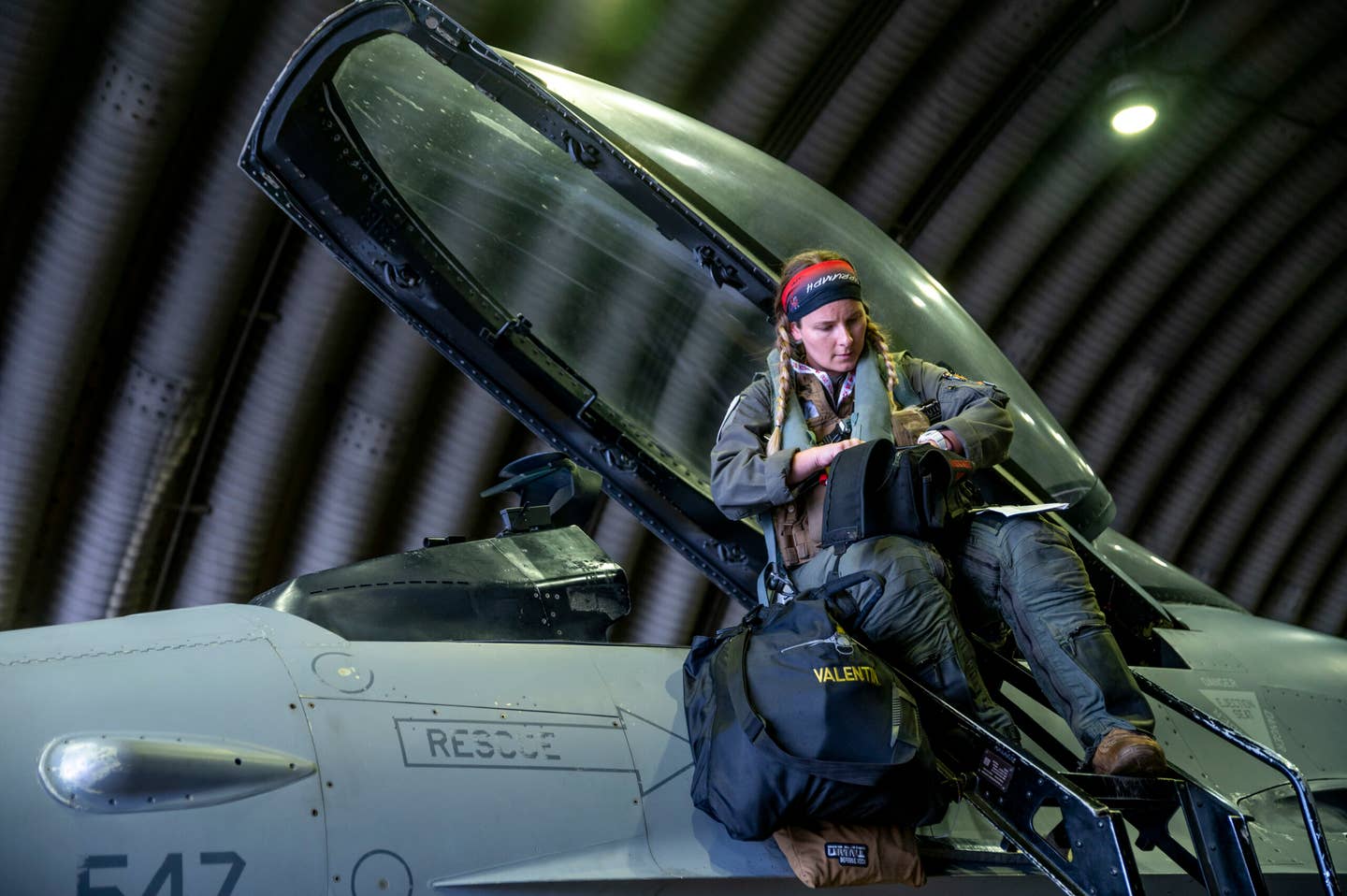 U.S. Air Force Captain Melanie Valentin, 36th Fighter Squadron pilot, prepares to enter the seat of an F‐16 Fighting Falcon to take off from Osan Air Base, Republic of Korea, November 6, 2023. <em>U.S. Air Force</em>