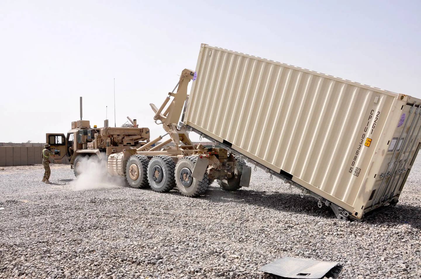 Standardized equipment for moving containers like the US Army M1074 Palletized Load System truck seen here could be used to readily move Containerized Weapon Systems in the counter-drone configuration from one location to another. <em>US Army</em>