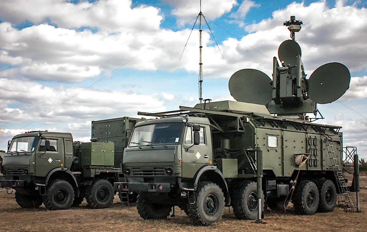 A picture showing a complete Krasukha-4 system, with the truck-mounted command post 'container' seen behind the vehicle carrying the EW component, in 2017., Russian Ministry of Defense 