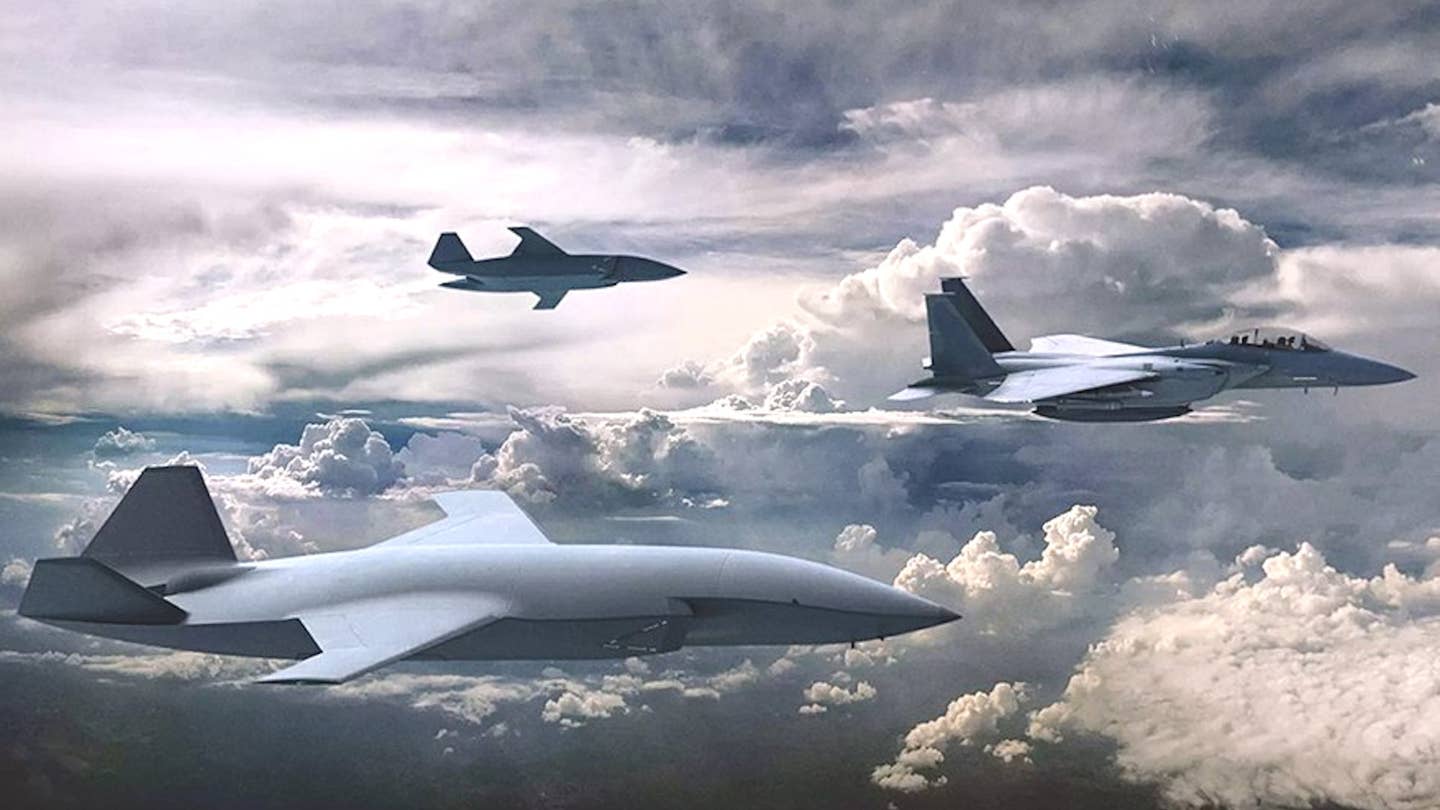 A rendering of an F-15 flying together with a pair of MQ-28 Ghost Bat drones, also made by Boeing, a contender to become one of the Air Force's future CCAs. <em>Boeing</em>