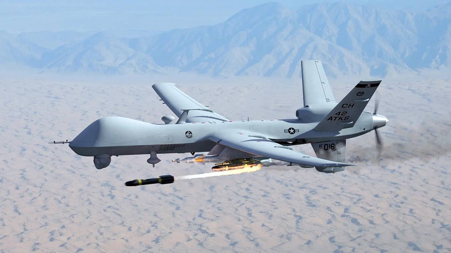 A US Air Force MQ-9 Reaper drone fires an AGM-114 Hellfire missile. <em>DOD</em>