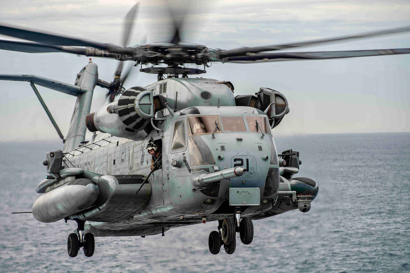 A Marine Corps CH-53E attached to Marine Medium Tiltrotor Squadron (VMM) 165 (Reinforced), 15th Marine Expeditionary Unit, takes off from the flight deck of amphibious transport dock USS <em>Somerset</em> (LPD-25) in the Pacific Ocean, on November 15, 2023. <em>U.S. Marine Corps Photo by Sgt. Patrick Katz</em>