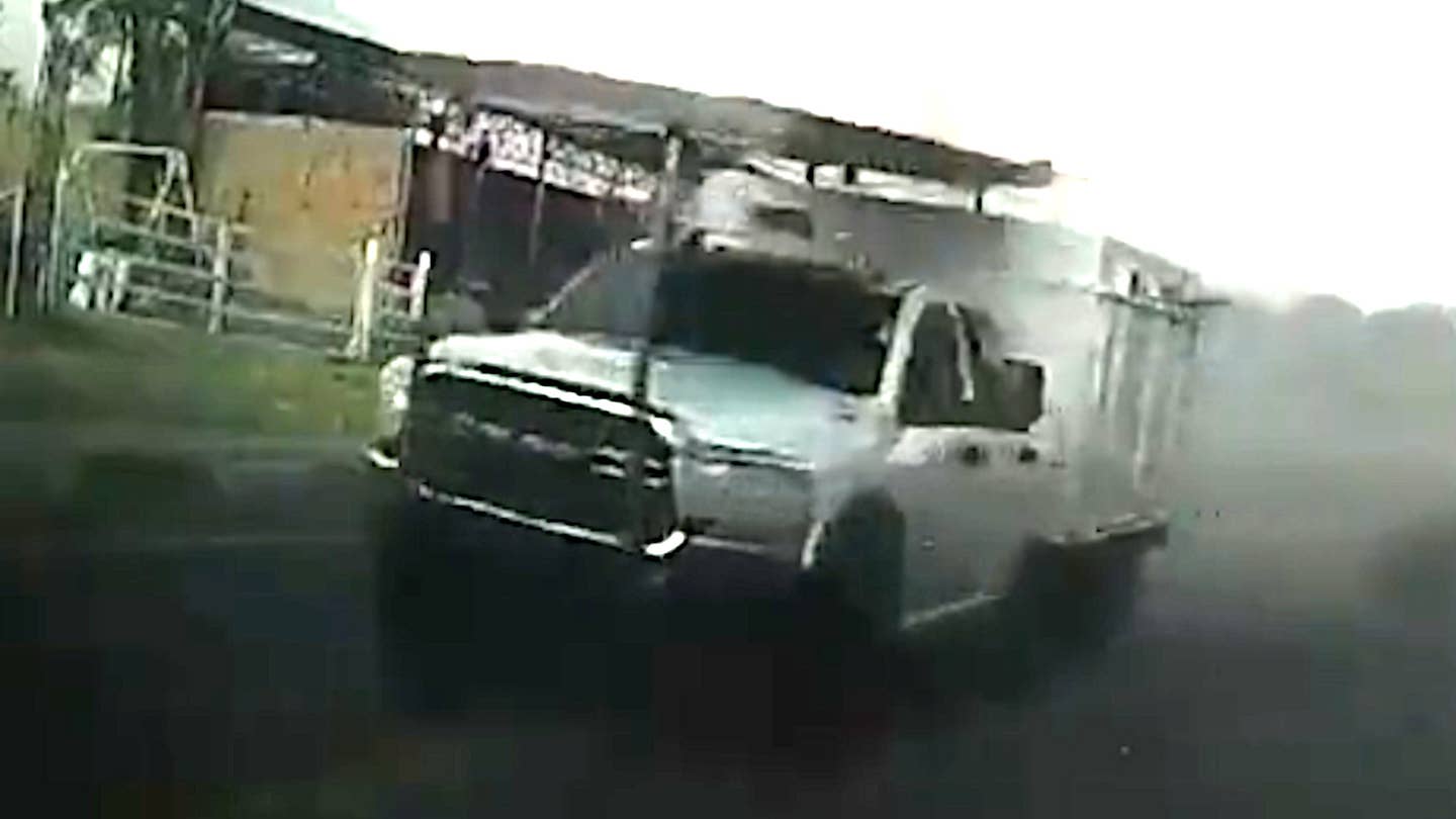 A grainy screen grab taken from a dash cam video shot from inside a Mexican security forces vehicle during the ambush on November 19. This offers another view of the Narco Tank with the additional armor over its front end. <em>Secretaría de la Defensa Nacional capture via X</em>