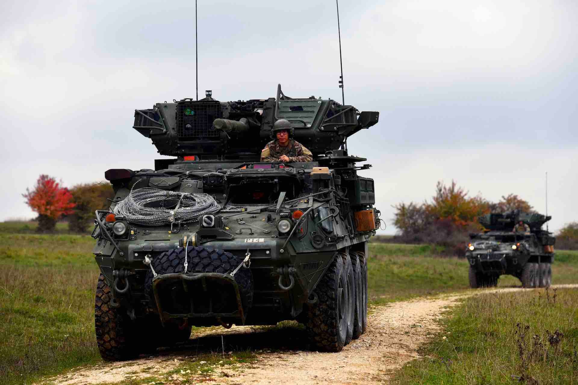 U.S. Soldiers, assigned to Palehorse Troop, 4th Squadron, 2nd Cavalry Regiment, maneuver in their Stryker vehicles during a situational training exercise at the 7th Army Training Command's Grafenwoehr Training Area, Germany, Oct. 13, 2022. 2CR provides the 7th ATC with a lethal and agile force capable of rapid deployment throughout the European theater in order to assure allies, deter adversaries, and when ordered, defend the NATO alliance. (U.S. Army photo by Markus Rauchenberger)