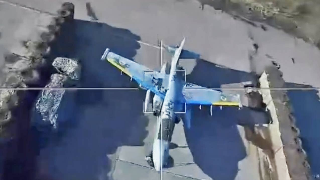 View of Su-25 attack jet decoy soon through optics of a Lancet loitering munition.