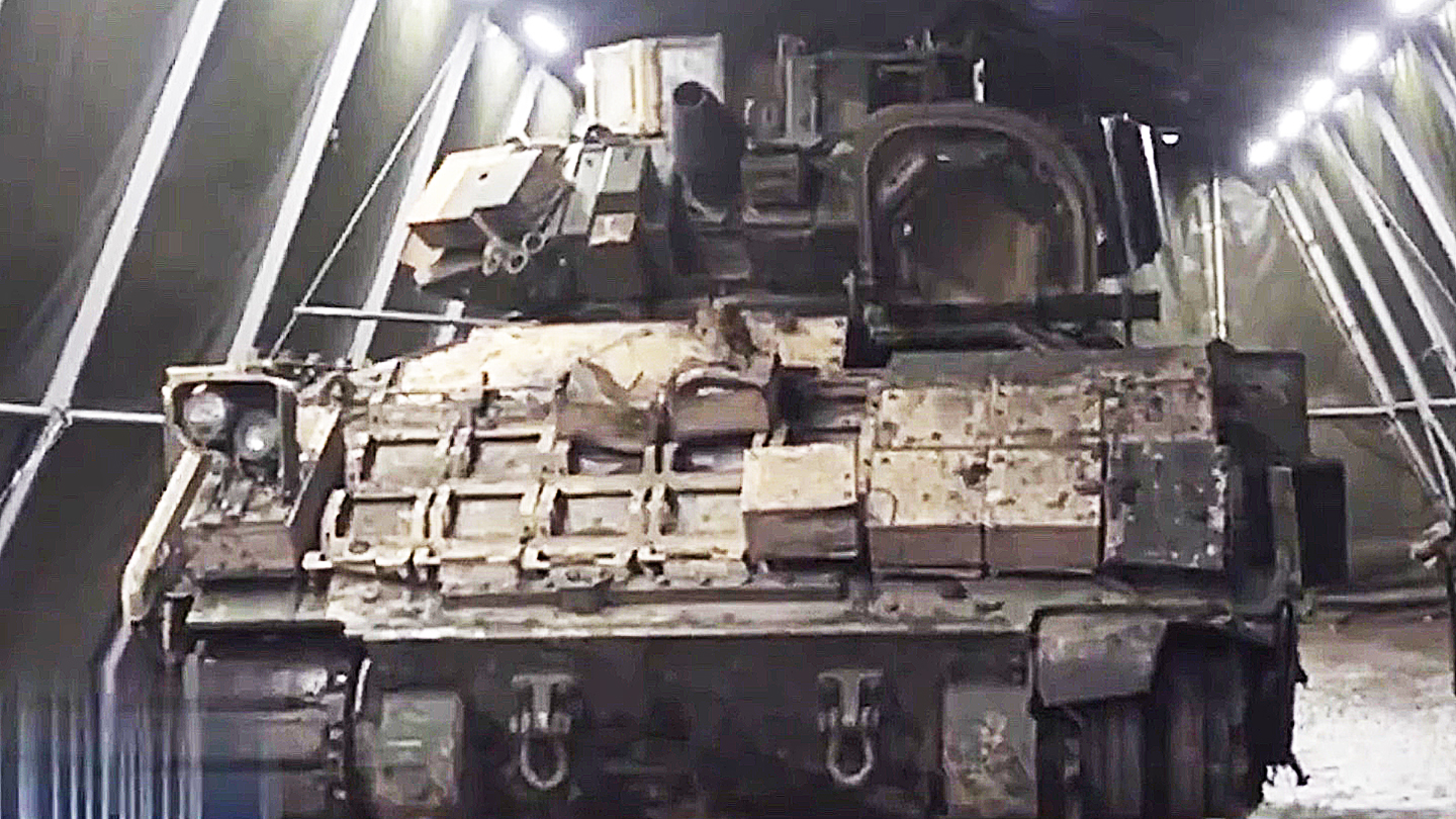 The Russians are examining a Bradley Fighting Vehicle they recently recovered from Ukraine.